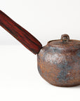 side handle tea pot with wooden handle on white background, back view