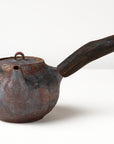 Side handle tea pot with wooden handle on white background. front view