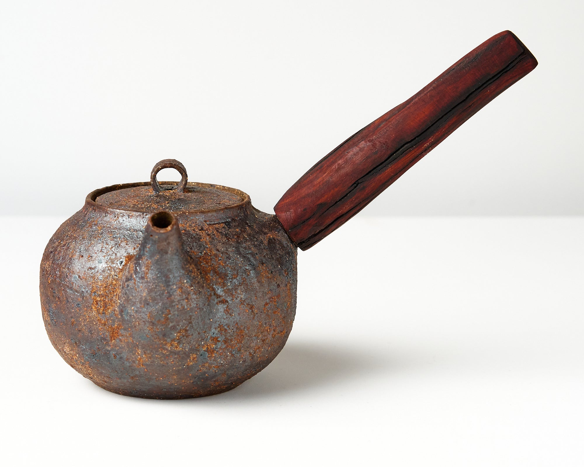 side handle tea pot with wooden handle on white background, front view