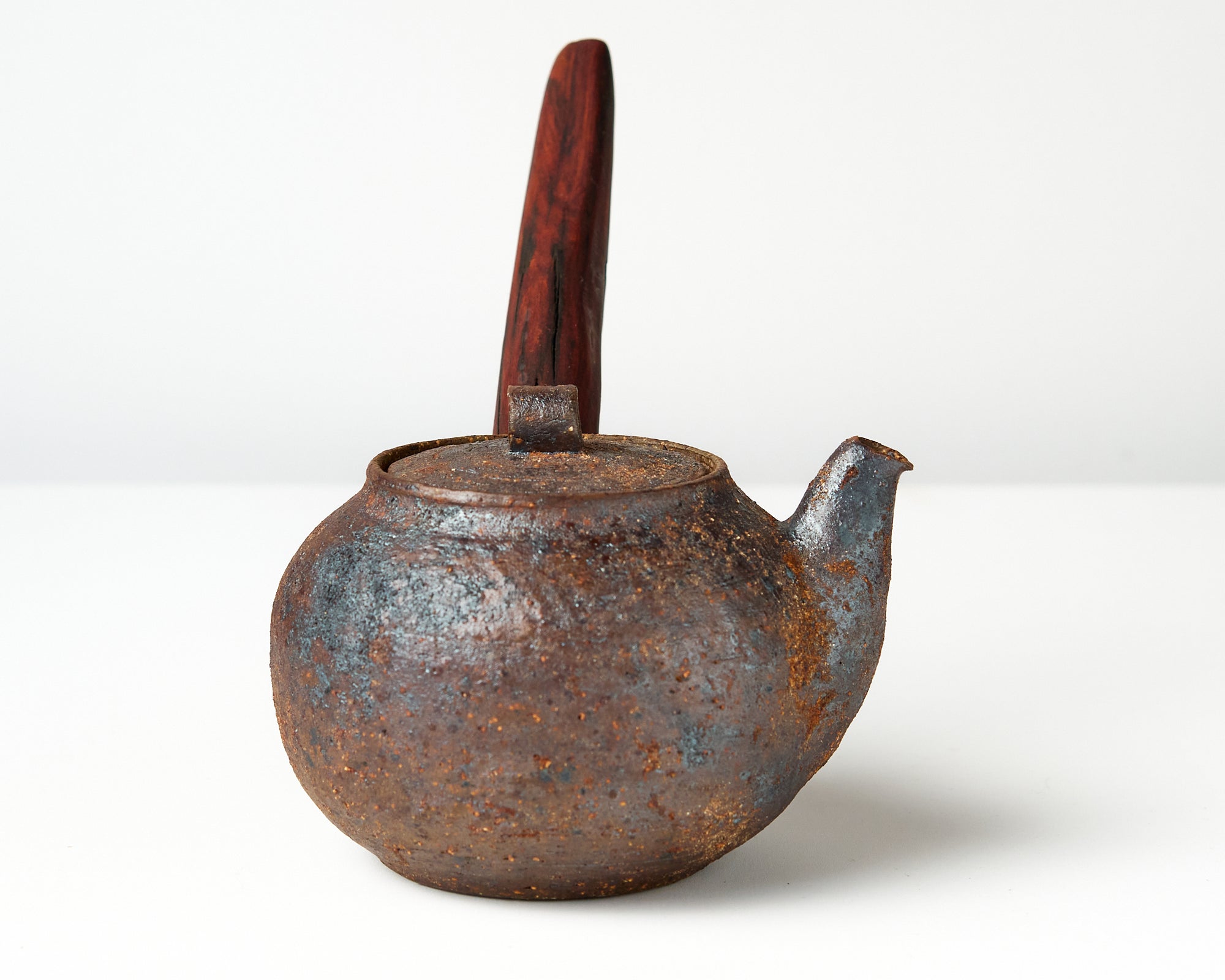 side handle tea pot with wooden handle on white background, side view