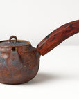Side handle tea pot with wooden handle on white background. front view 