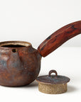 Side handle tea pot with wooden handle on white background. front view with lid off