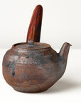 Side handle tea pot with wooden handle on white background. side view 